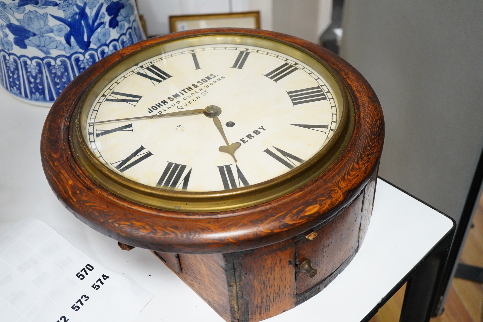 A John Smith & Sons of Derby oak wall clock, 39cm
